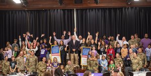 U.S. Airmen, Lanier County military children, Moody Air Force Base and Georgia Department of Education representatives pose for a picture