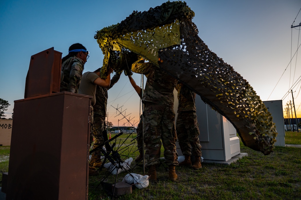 U.S. Airmen assigned to the 23rd Communications Squadron set up antennas during Exercise Ready Tiger 24-1 at Savannah Air National Guard Base, Georgia, April 14, 2024. Airmen responded to an exercise scenario that required communications to be recalibrated at night. During Ready Tiger 24-1, the 23rd Wing will be evaluated on the integration of Air Force Force Generation principles such as Agile Combat Employment, integrated combat turns, forward aerial refueling points, multi-capable Airmen, and combat search and rescue capabilities. (U.S. Air Force photo by Senior Airman Courtney Sebastianelli)
