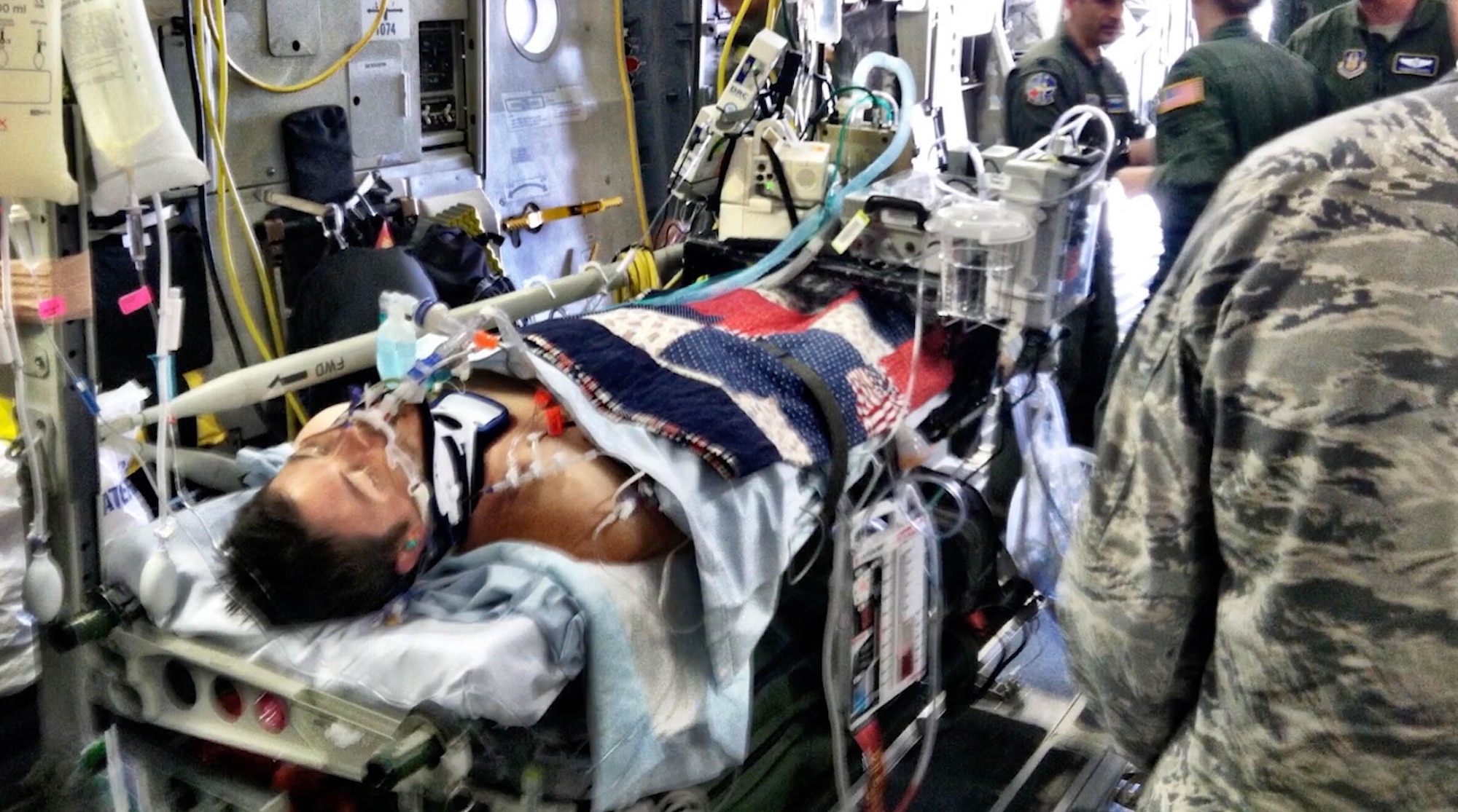 U.S. Air Force 2nd Lt. Nate Nelson, 22nd Special Tactics Squadron intelligence officer, is transported to the United States on a C-17 Globemaster III medical evacuation flight in 2013. Nelson was critically injured from a rocket attack in Afghanistan during Operation Enduring Freedom four days earlier. (Courtesy photo)