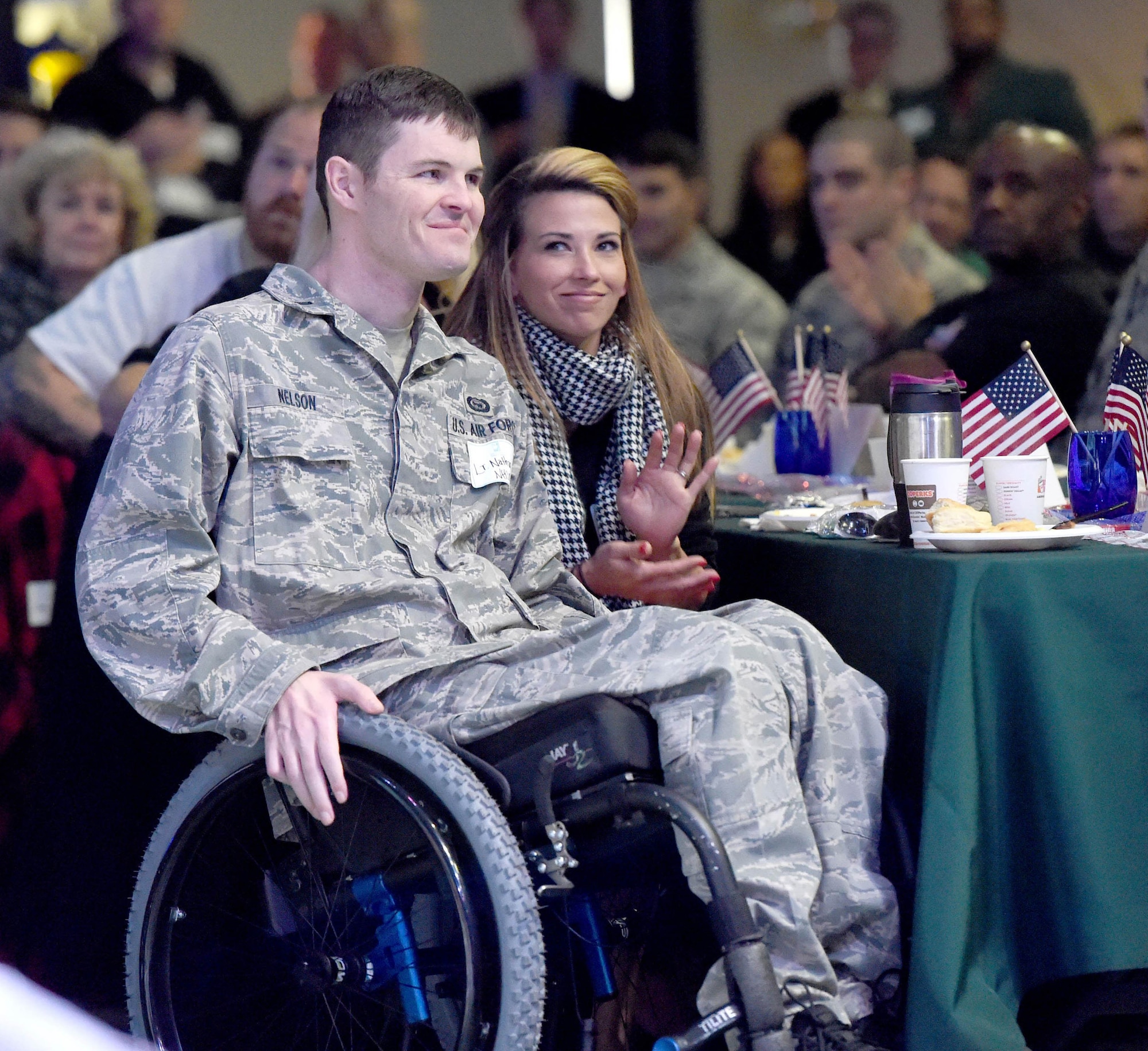 U.S. Air Force 1st Lt. Nate Nelson, 24th Special Operations Wing intelligence officer, and his wife Jennifer, are honored during a Florida Chamber of Commerce breakfast  Fort Walton Beach, Florida, on March 6, 2015. (Courtesy photo by Nick Tomecek/Northwest Florida Daily News)