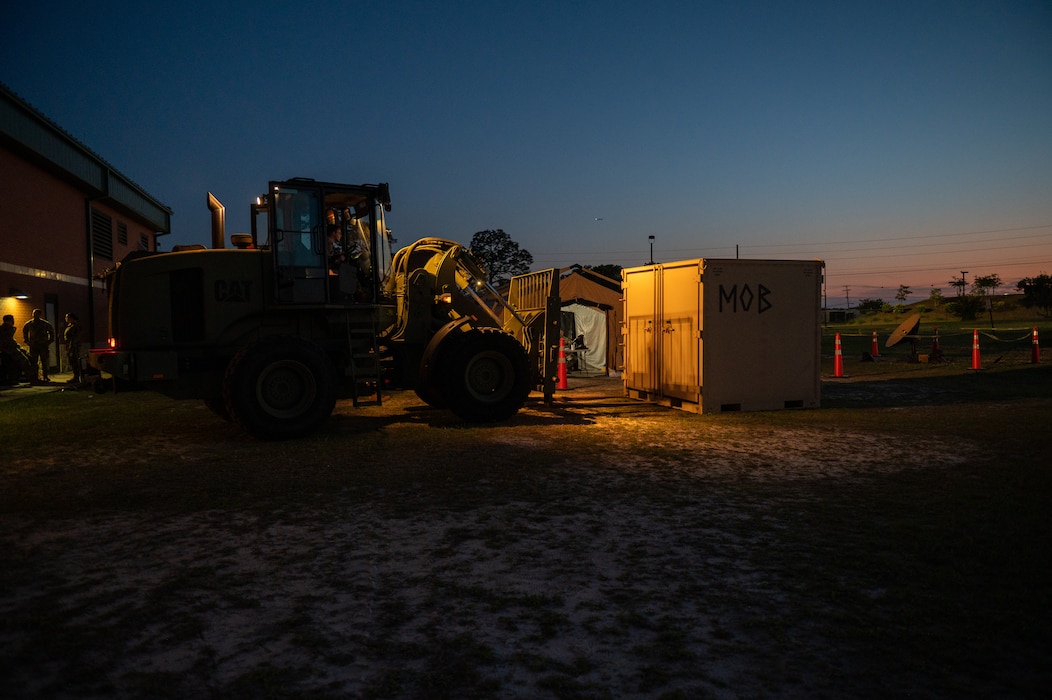 A U.S. Airman prepares to move cargo during Exercise Ready Tiger 24-1 at Savannah Air National Guard Base, Georgia, April 14, 2024. During Ready Tiger 24-1, exercise inspectors will assess the 23rd Wing's proficiency in employing decentralized command and control to fulfill air tasking orders across geographically dispersed areas amid communication challenges, integrating Agile Combat Employment principles such as integrated combat turns, forward aerial refueling points, multi-capable Airmen, and combat search and rescue capabilities. (U.S. Air Force photo by Senior Airman Courtney Sebastianelli)