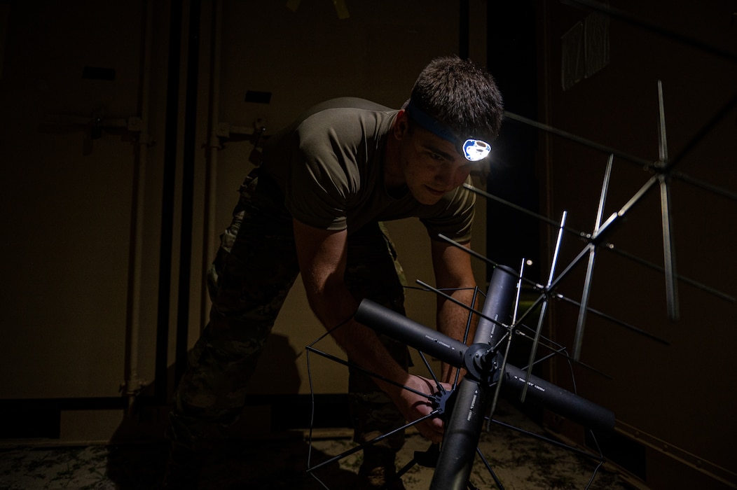 A U.S. Air Force Airman assigned to the 23rd Communications Squadron sets up an antenna during Exercise Ready Tiger 24-1 at Savannah Air National Guard Base, Georgia, April 14, 2024. Airmen responded to an exercise scenario that required communications to be recalibrated at night. Built upon Air Combat Command's directive to assert air power in contested environments, Exercise Ready Tiger 24-1 aims to test and enhance the 23rd Wing’s proficiency in executing Lead Wing and Expeditionary Air Base concepts through Agile Combat Employment and command and control operations. (U.S. Air Force photo by Senior Airman Courtney Sebastianelli)