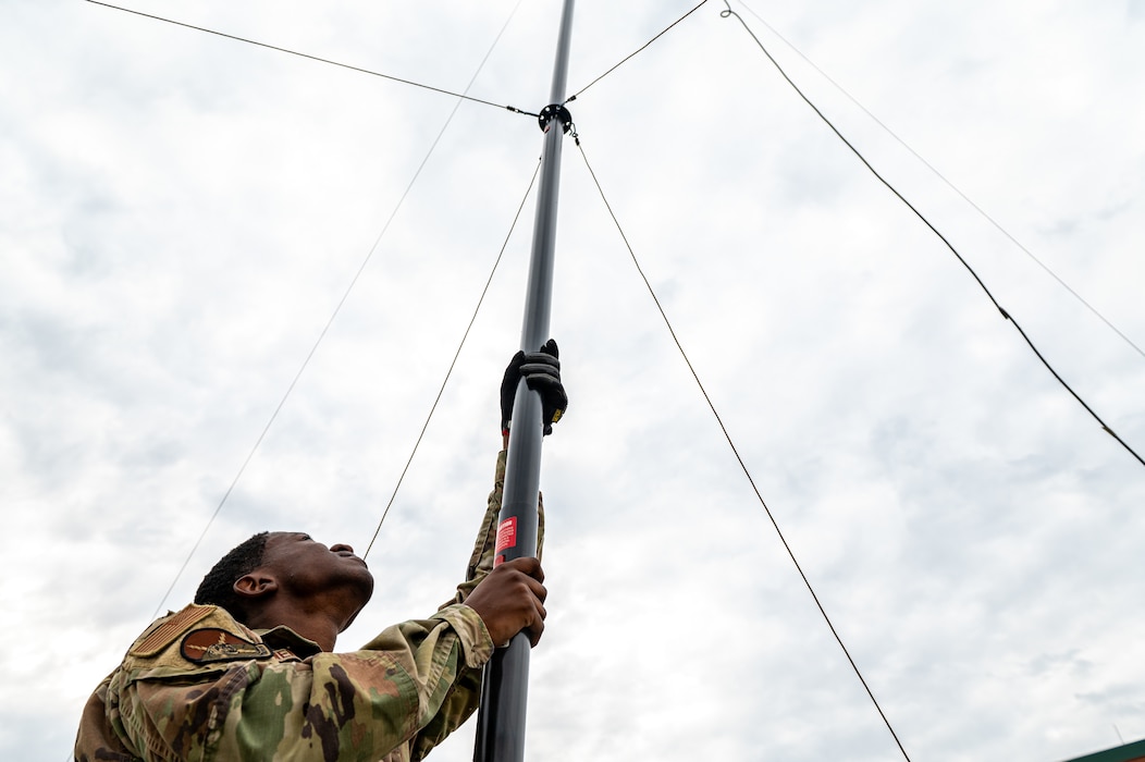 U.S. Air Force Senior Airman Gregory Owens, 23rd Communications Squadron client system technician, supports an antenna during Exercise Ready Tiger 24-1 at Savannah Air National Guard Base, Georgia, April 9, 2024. Ready Tiger 24-1 serves as a steppingstone to prepare for Agile Flag, an Air Force Force Generation certifying exercise, later this year. Built upon Air Combat Command's directive to assert air power in contested environments, Exercise Ready Tiger 24-1 aims to test and enhance the 23rd Wing’s proficiency in executing Lead Wing and Expeditionary Air Base concepts through Agile Combat Employment and command and control operations. (U.S. Air Force photo by Senior Airman Courtney Sebastianelli)