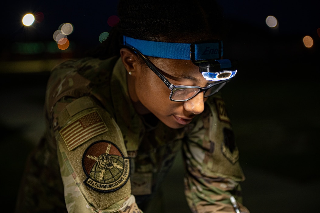 U.S. Air Force Airman 1st Class Samera Epperson, 23rd Communications Squadron tactical radio technician, focuses during Exercise Ready Tiger 24-1 at Savannah Air National Guard Base, Georgia, April 14, 2024. Built upon Air Combat Command's directive to assert air power in contested environments, Exercise Ready Tiger 24-1 aims to test and enhance the 23rd Wing’s proficiency in executing Lead Wing and Expeditionary Air Base concepts through Agile Combat Employment and command and control operations. (U.S. Air Force photo by Senior Airman Courtney Sebastianelli)