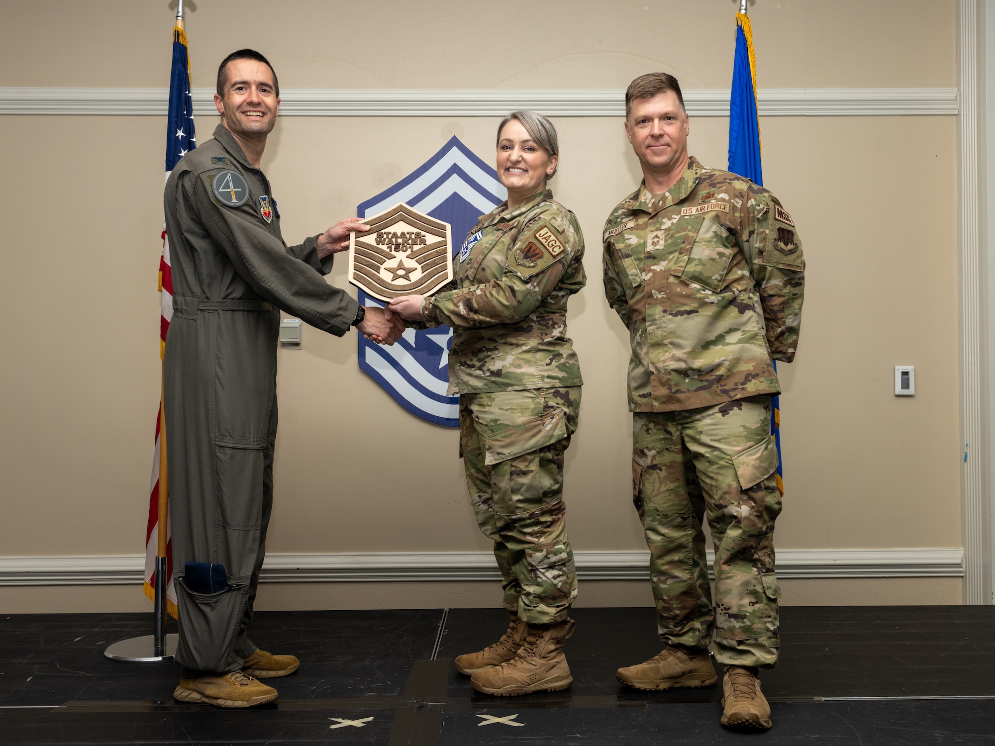 U.S Air Force Col. Morgan Lohse, 4th Fighter Wing commander (left), and Chief Master Sgt. Edward Mueller, Mission support Group senior enlisted leader, presents a plaque to Senior Master Sgt. select Mary Staats Walker (center), law office superintendent, during a Senior Master Sergeant release ceremony at Seymour Johnson Air Force Base, North Carolina, March 28, 2024. The ceremony allowed wing leadership, family and friends to recognize the base’s newest Senior Master Sergeant selects. (U.S. Air Force photo by Airman Megan Cusmano)