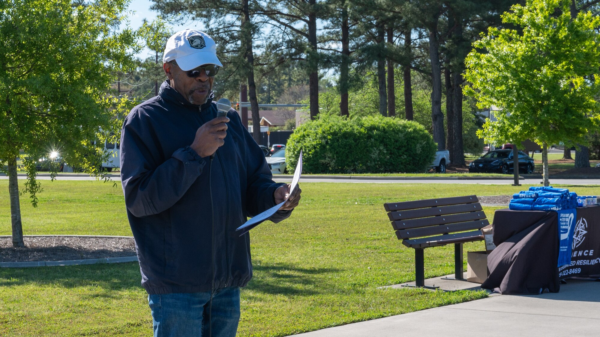 Jerome Ellis, a family advocacy officer at the Family Advocacy Center, speaks on behalf of child abuse prevention during a pinwheel event at Seymour Johnson Air Force Base, North Carolina, Apr. 4, 2024. The event promoted the importance of healthy family dynamics. (U.S. Air Force Photo by Airman Rebecca Tierney)