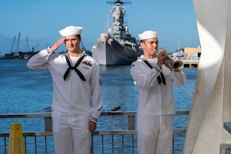 Sailors play "Taps" at the USS Arizona Memorial during a memorial service for retired Lt. Cmdr. Louis “Lou” Conter, the last survivor of the Dec. 7, 1941 Japanese attack on the USS Arizona (BB 39).