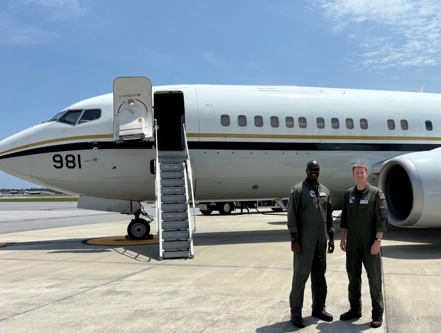 Lt. Cmdr. Diego McKnight (left) and Lt. Cmdr. Mike Carr (right) pose for a photo in front of the C-40 aircraft upon landing and disembarking the Naval Sea Cadets. Both pilots are Navy reservists that are also commercial pilots for American Airlines and FedEx respectively. Fleet Logistics Support Squadron 59 (VR-59) is a logistics squadron that provides essential, responsive and flexible airlift in support of the Navy’s peacetime operations, combat missions, humanitarian assistance and disaster relief worldwide. (U.S. Navy photo by Lt. Ashley Hutson)