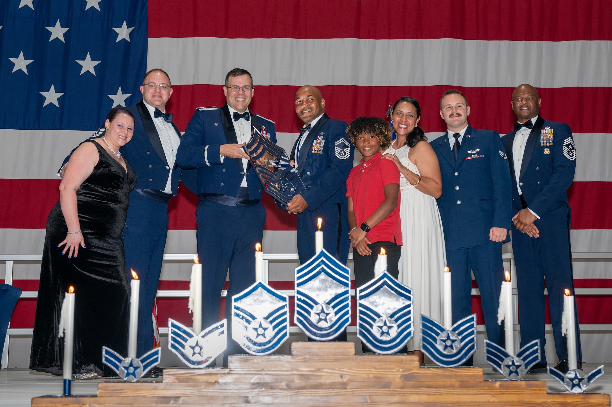 U.S. Air Force Senior Master Sgt. John Jackson Jr., the 22nd Attack Squadron senior enlisted leader, receives a recognition plaque during the chief master sergeant recognition ceremony at Nellis Air Force Base, Nevada, April 20, 2024.