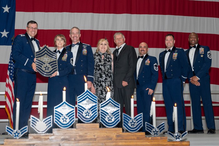 U.S. Air Force Senior Master Sgt. Angela Pate, the 732nd Operations Support Squadron senior enlisted leader, receives a recognition plaque during the chief master sergeant recognition ceremony at Nellis Air Force Base, Nevada, April 20, 2024.
