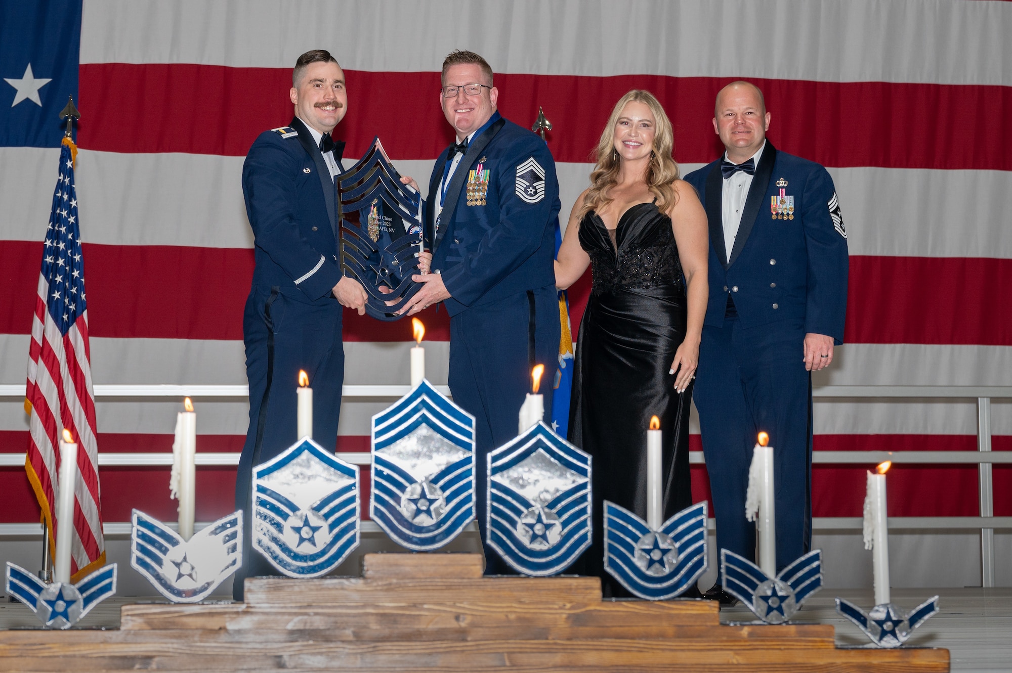 U.S. Air Force Chief Master Sgt. Daniel Chase, the 926th Security Forces Squadron senior enlisted leader, receives a recognition plaque during the chief master sergeant recognition ceremony at Nellis Air Force Base, Nevada, April 20, 2024.
