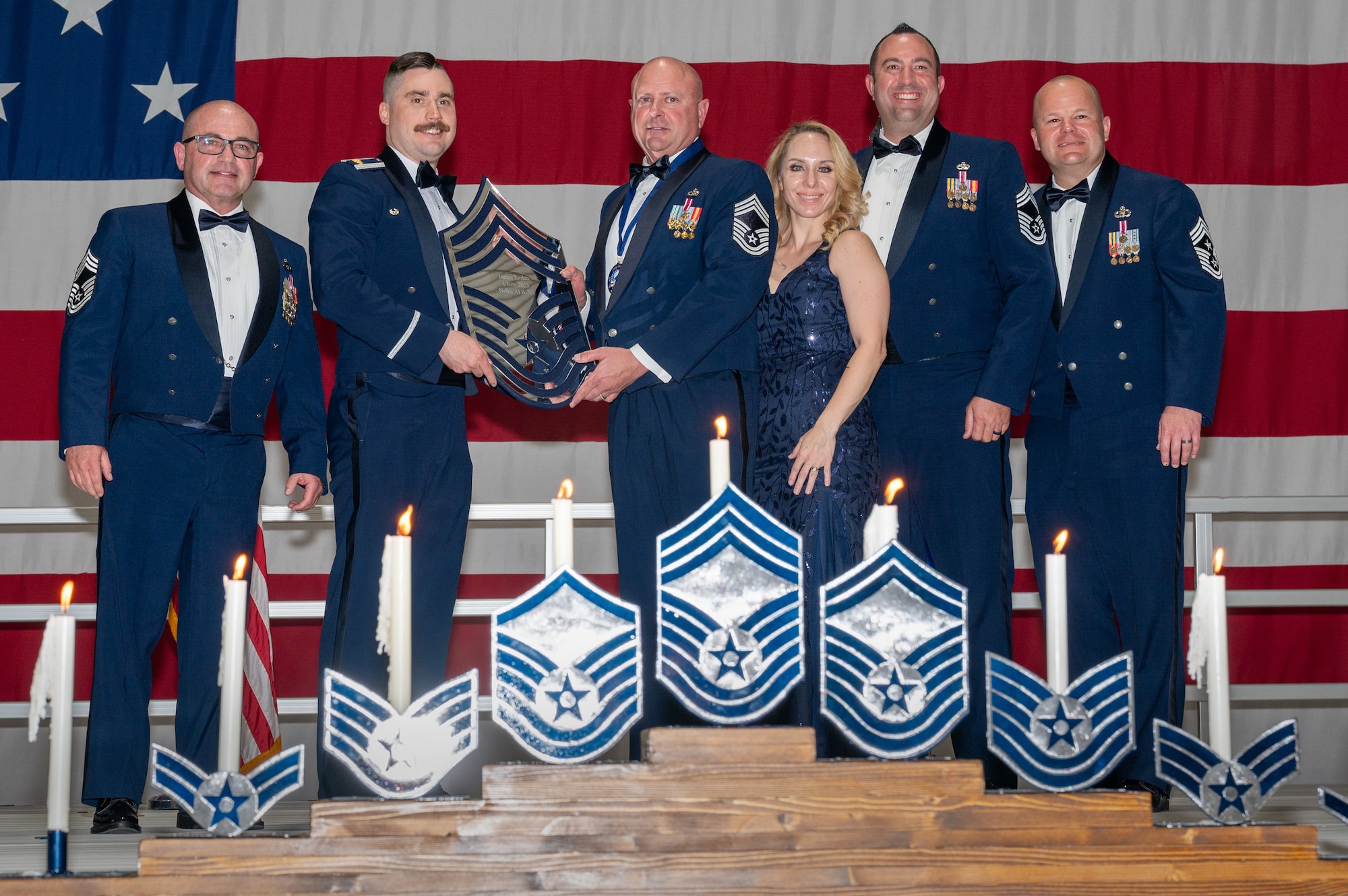 U.S. Air Force Chief Master Sgt. James Jordan, the 926th Maintenance Group quality assurance superintendent, receives a recognition plaque during the chief master sergeant recognition ceremony at Nellis Air Force Base, Nevada, April 20, 2024.