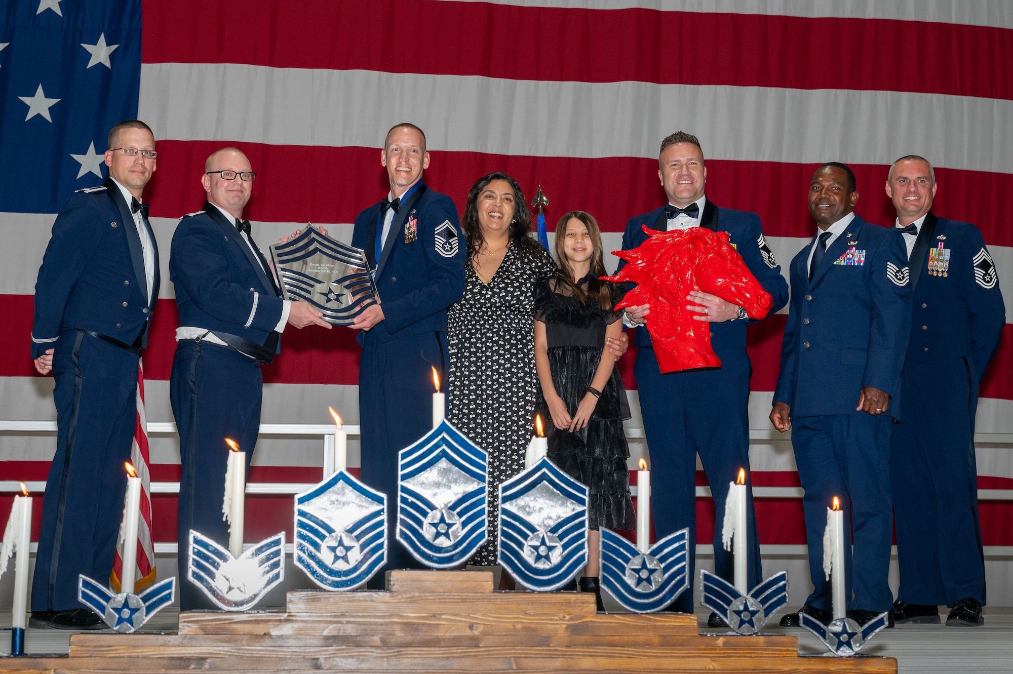 U.S. Air Force Senior Master Sgt. Brad Gurley, the 820th Rapid Engineer Deployable Heavy Operational Repair Squadron Engineers vertical operations flight chief, receives a recognition plaque during the chief master sergeant recognition ceremony at Nellis Air Force Base, Nevada, April 20, 2024.
