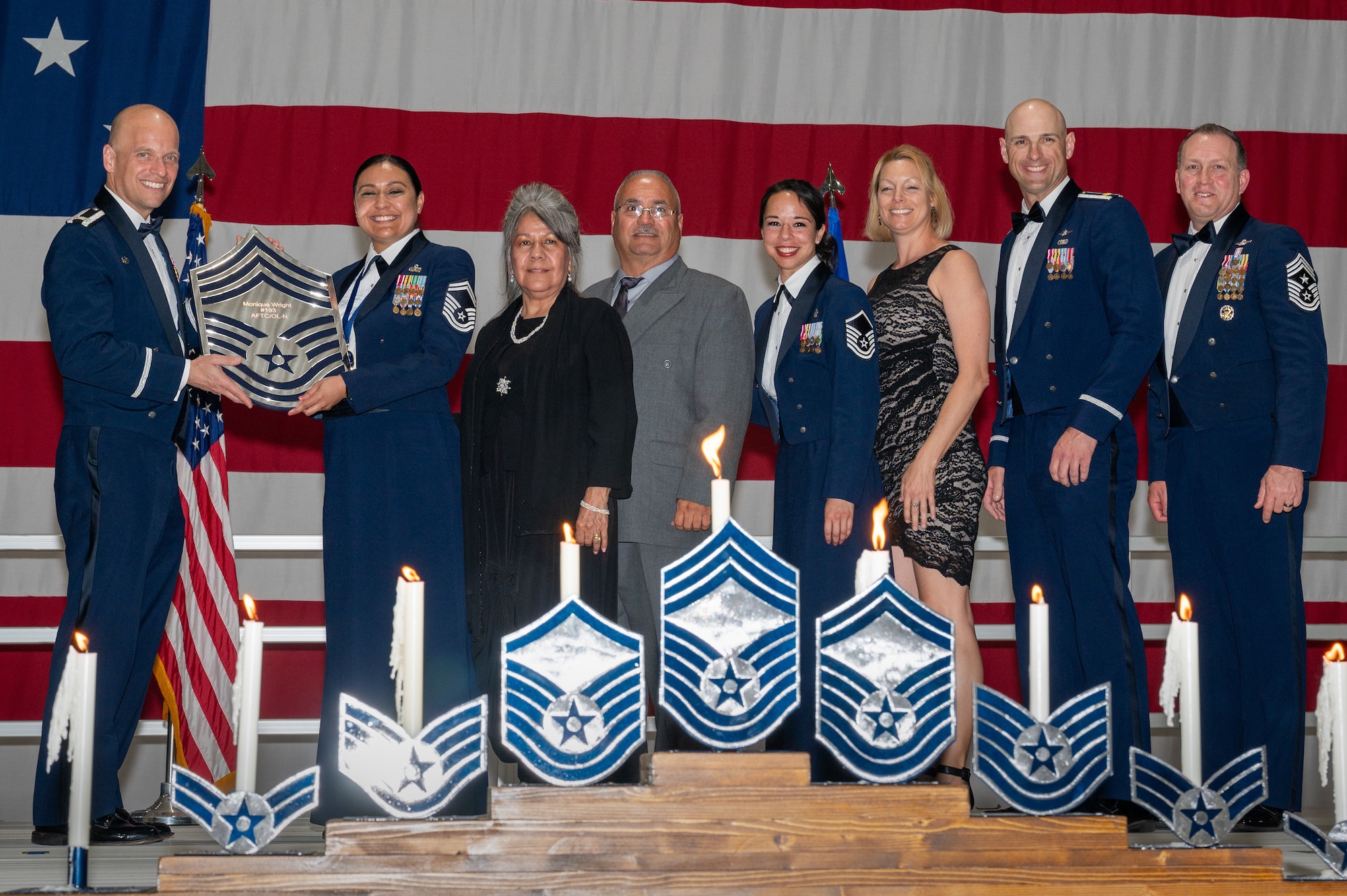 U.S. Air Force Senior Master Sgt. Monique Wright, the Air Force Test Center communications squadron senior enlisted leader, receives a recognition plaque during the chief master sergeant recognition ceremony at Nellis Air Force Base, Nevada, April 20, 2024.