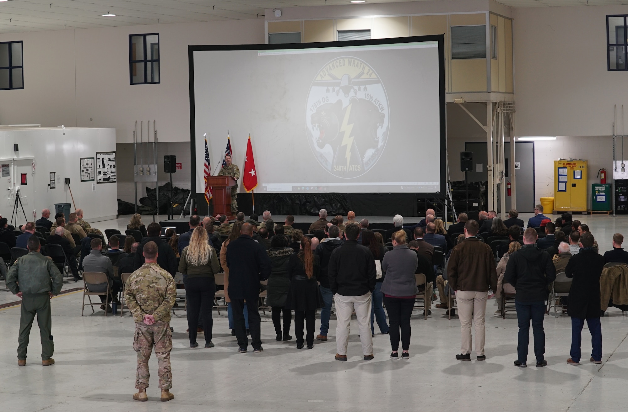 State officials, military leaders, and other community members gather for a presentation on the current capabilities and mission of the 178th Wing at Springfield-Beckley Air National Guard Base, Ohio, March 18, 2024. Airmen assigned to the 178th Wing recently completed a historic landing of the MQ-9 Reaper using auto take-off and land technology. (U.S. Air National Guard photo by Staff Sgt. Jillian Maynus)