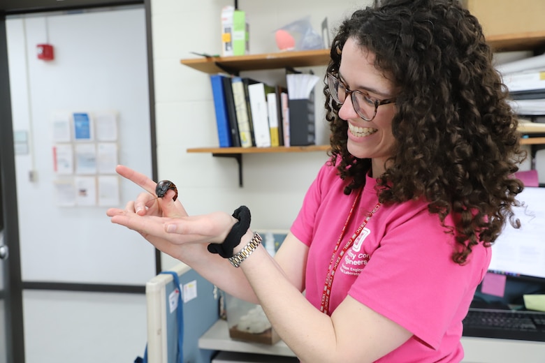 CERL research microbiologist Anne McCarthy using Madagascar hissing cockroaches for her project - Insect antennae for odorant-driven real-time decision processing.  She is hoping to learn if their antennae can help identify and sense chemicals in an area that can affect a Soldier.