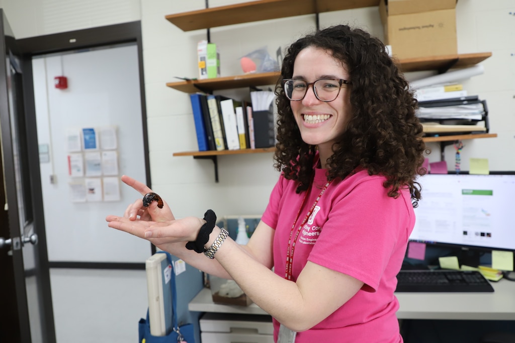 CERL research microbiologist Anne McCarthy using Madagascar hissing cockroaches for her project - Insect antennae for odorant-driven real-time decision processing.  She is hoping to learn if their antennae can help identify and sense chemicals in an area that can affect a Soldier.