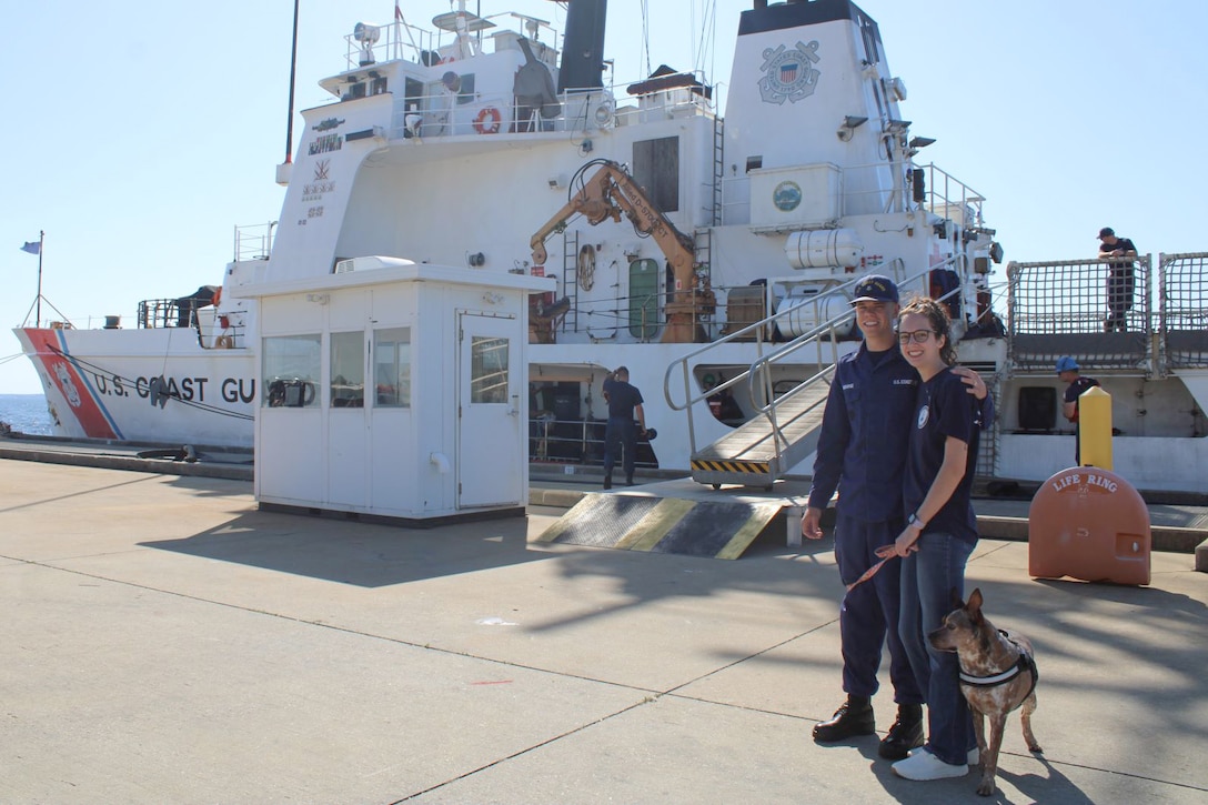 Petty Officer 2nd Class Darrell Bosarge, an operations specialist assigned to U.S. Coast Guard Cutter Dauntless (WMEC 624), poses for a photo with his family after the cutter returned home from deployment, April 24, 2024, in Pensacola, Florida. Dauntless deployed for two months to support Operation Vigilant Sentry while conducting maritime safety and security missions. (U.S. Coast Guard photo by Lt.j.g. Olivia Gonzalez)