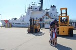 Chief Petty Officer David Krahn, an operations specialist assigned to U.S. Coast Guard Cutter Dauntless (WMEC 624), hugs his family after Dauntless returned home from deployment, April 24, 2024, in Pensacola, Florida. Dauntless deployed for two months to support Operation Vigilant Sentry while conducting maritime safety and security missions. (U.S. Coast Guard photo by Lt.j.g. Olivia Gonzalez)