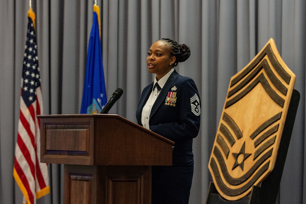 U.S. Air Force Chief Master Sgt. Carolyn Russell, right, 436th Airlift Wing command chief, speaks to the 2024 Chief Recognition Ceremony honorees and guests at Dover Air Force Base, Delaware, April 19, 2024. Russell was the guest speaker for the ceremony and delivered the chief’s charge to those being recognized. (U.S. Air Force photo by Roland Balik)