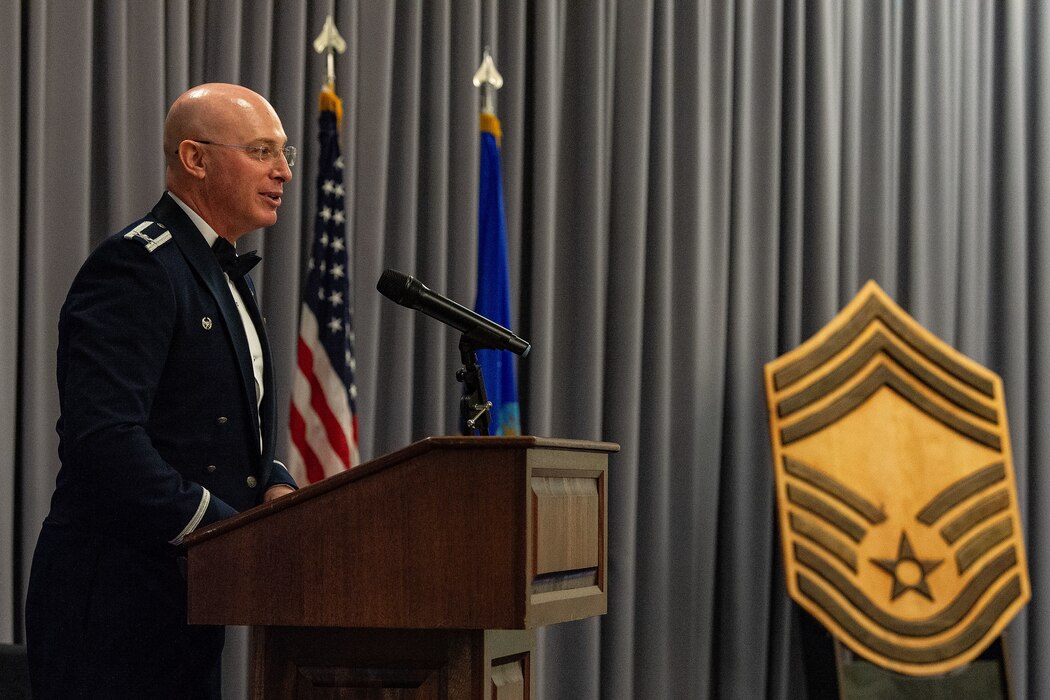 U.S. Air Force Col. Chris McDonald, left, 436th Airlift Wing commander, gives closing remarks to 2024 Chief Recognition Ceremony honorees and guests at Dover Air Force Base, Delaware, April 19, 2024. The ceremony was held to recognize those who have achieved the highest enlisted rank that, by law, can only be held by one percent of all enlisted members. (U.S. Air Force photo by Roland Balik)