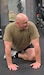 Command Sgt. Maj. Shawn Phillips, Pennsylvania National Guard command senior enlisted leader, works out with Airmen from the 193rd Special Operations Wing's 148th Air Support Operations Squadron during the filming of one of his 