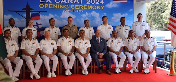 240422-N-NR876-1430 CHATTOGRAM, Bangladesh (April 22, 2024) - Distinguished guests from the U.S. Embassy to Bangladesh, Navy, Marine Corps, and Bangladesh Navy pose for a group photo after the opening ceremony of Cooperation Afloat Readiness and Training (CARAT) Exercise Bangladesh 2024 in Chattogram, Bangladesh Apr. 22. CARAT Bangladesh is a week-long exercise that seeks to enhance collaboration focused on shared maritime security challenges in the region. As the 30th iteration of the CARAT series, 2024 highlights the longstanding role of CARAT as a credible venue for regional Allies and partners to address shared maritime security priorities.