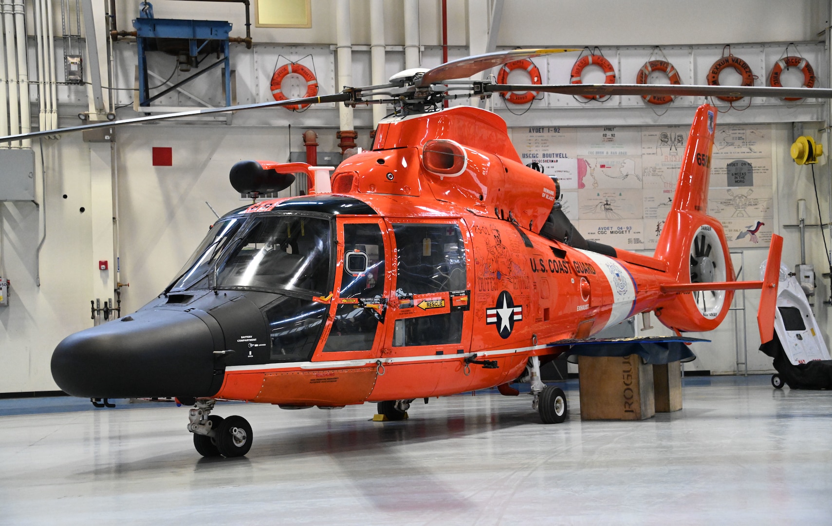 An MH-65 Dolphin helicopter rests at Air Station Kodiak April 23, 2024. Air Station Kodiak will be the fourth Coast Guard Air Station to transition to a single rotary-wing ship and shore-based fleet of nine MH-60 Jayhawks in 2025. (U.S. Coast Guard photo by Petty Officer Second Class Ian Gray