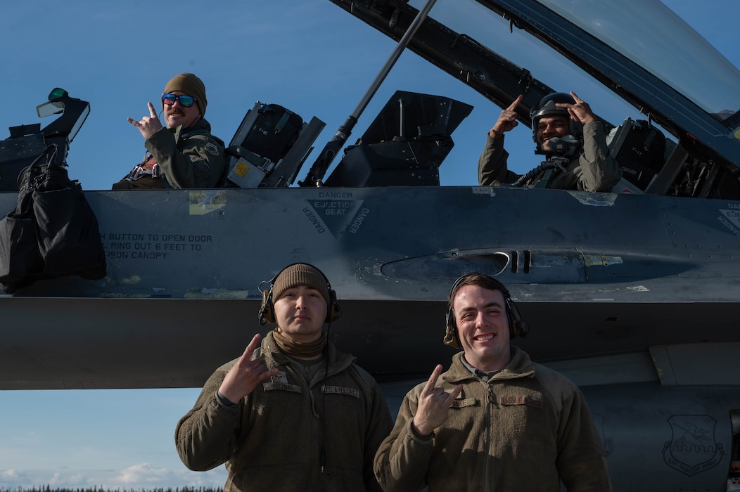 Airmen assigned to the 51st Fighter Wing pose for a photo.