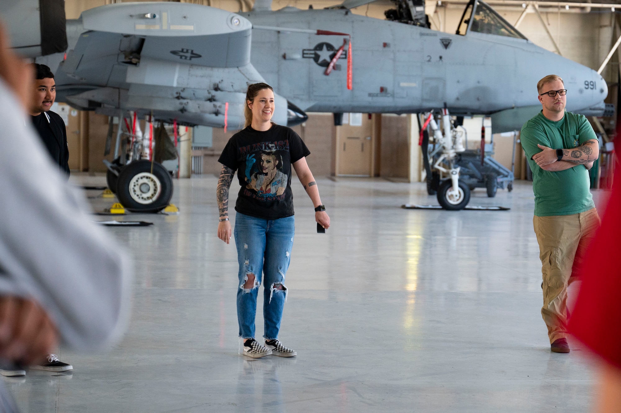 U.S. Air Force Staff Sgt. Heather Tindell, 757th Aircraft Maintenance Squadron integrated resiliency training assistant, listens to Airmen during an icebreaker exercise for Mindful Maintainer Day at Nellis Air Force Base, Nevada, March 28, 2024.