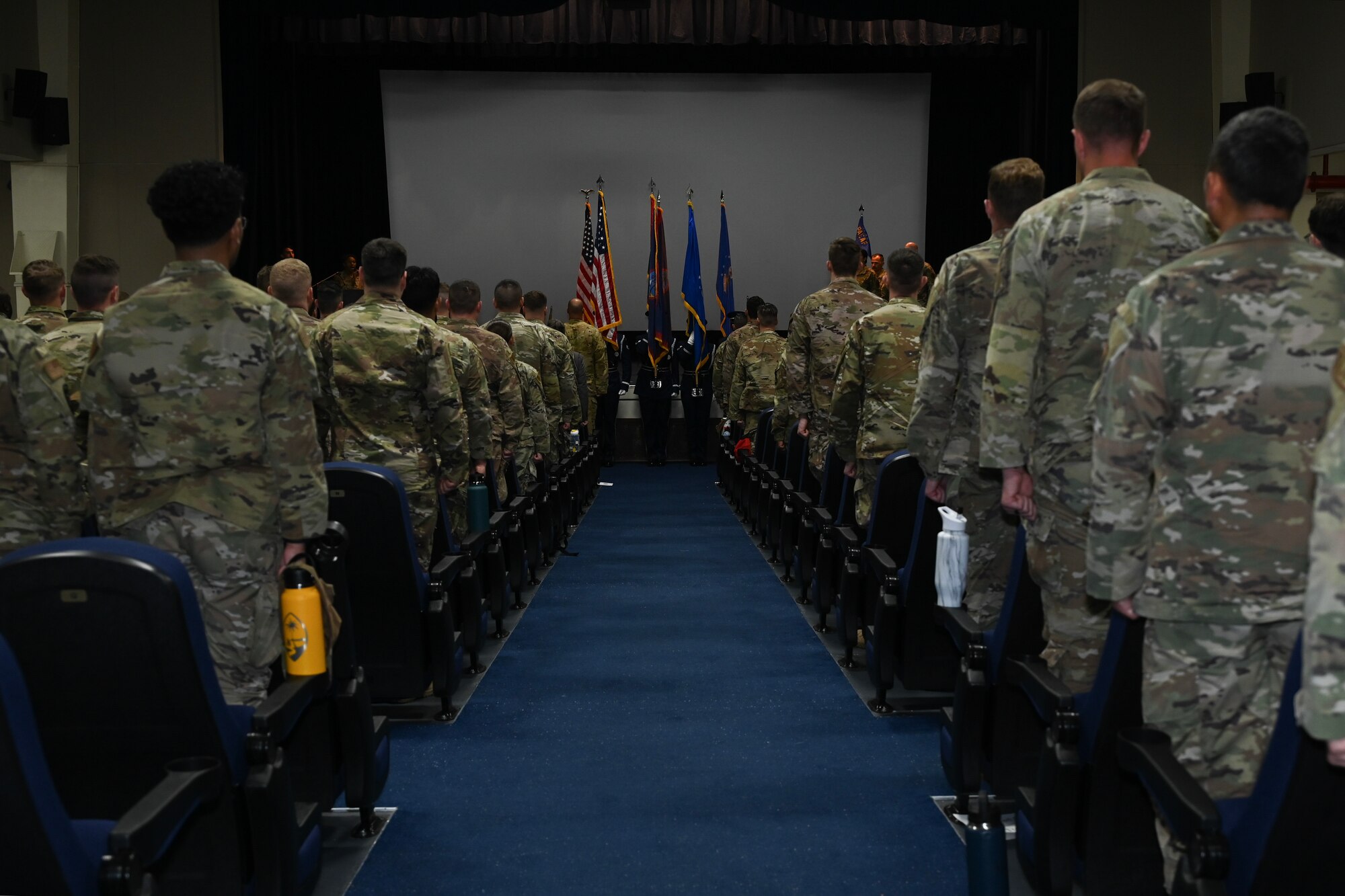 Airmen from the 356th Expeditionary Civil Engineer Group stand in attention stance.