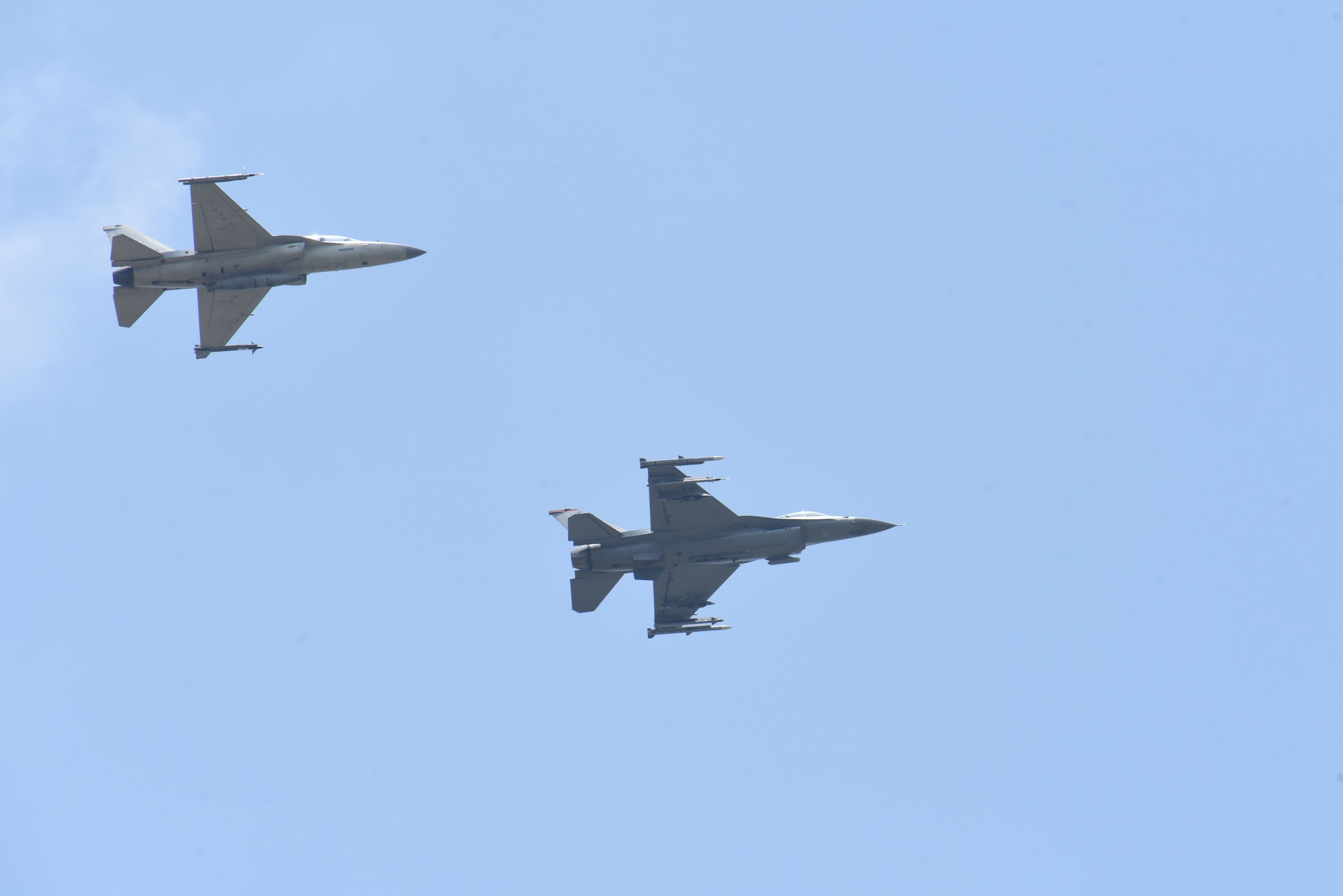 An U.S. Air Force F-16 Fighting Falcon and a Philippine Air Force FA-50 fly together as part of flight integration training at Basa Air Base, Philippines during Cope Thunder 24-1, Apr. 11, 2024. Through the bilateral training opportunity, Cope Thunder 24-1, the United States and Philippines continue enhancing their collective readiness and deterrence of present and future challenges. (U.S. Air Force photo by Master Sgt. Darnell T. Cannady)