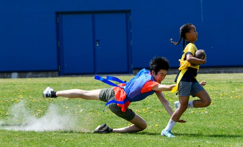 A player tries to pull a flag of an opponent.