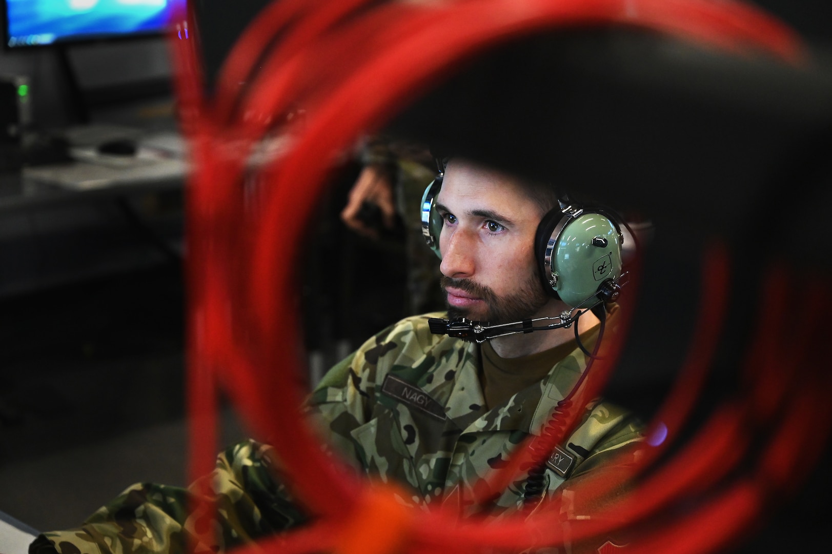 Hungarian Defence Forces 1st Lt. Mate Nagy, a fighter controller assigned to the Common Reporting Center,  trains on large force employment tactics during a joint training exercise March 22, 2024 in Blue Ash, Ohio. Success in contested environments depends on how well U.S. forces combine with the broad range of allied and partner capabilities and expertise to secure our common interests and promote our shared values. (U.S. Air National Guard photo by Shane Hughes)