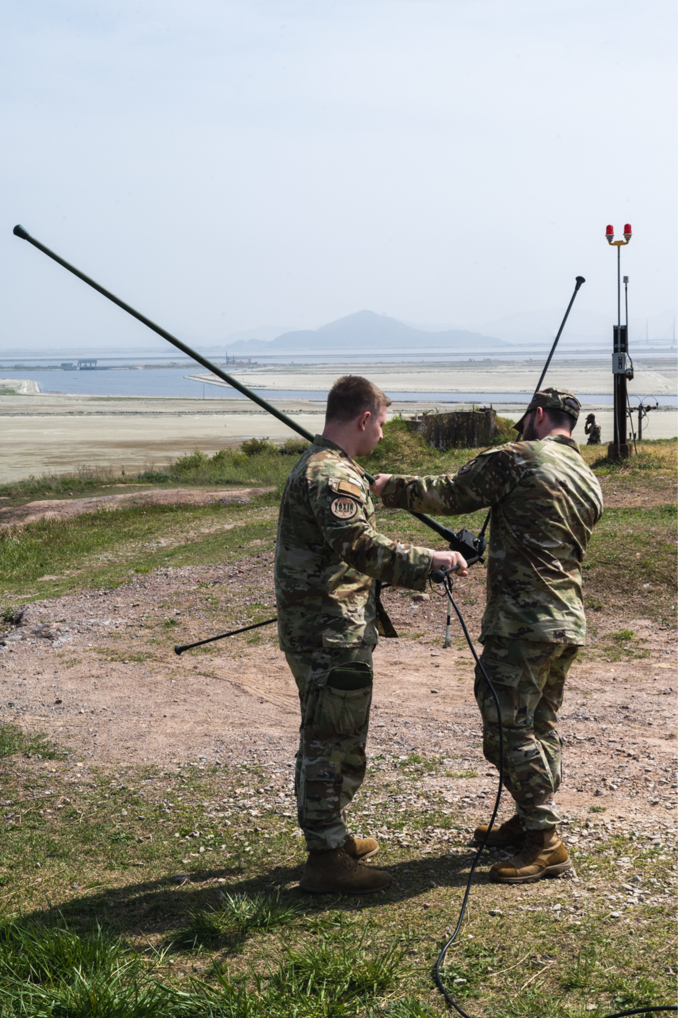 1st Lt. David Gaisford and Staff Sgt. Christopher Lage set up an antenna.