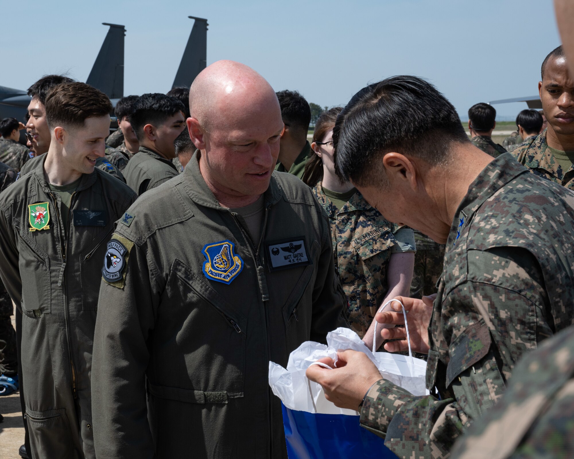 Republic of Korea Air Force Chief of Staff Gen. Lee, Young Su receives a gift from U.S. Air Force Col. Mathew Gaetke, 8th Fighter Wing commander, after his visit to Kunsan Air Base