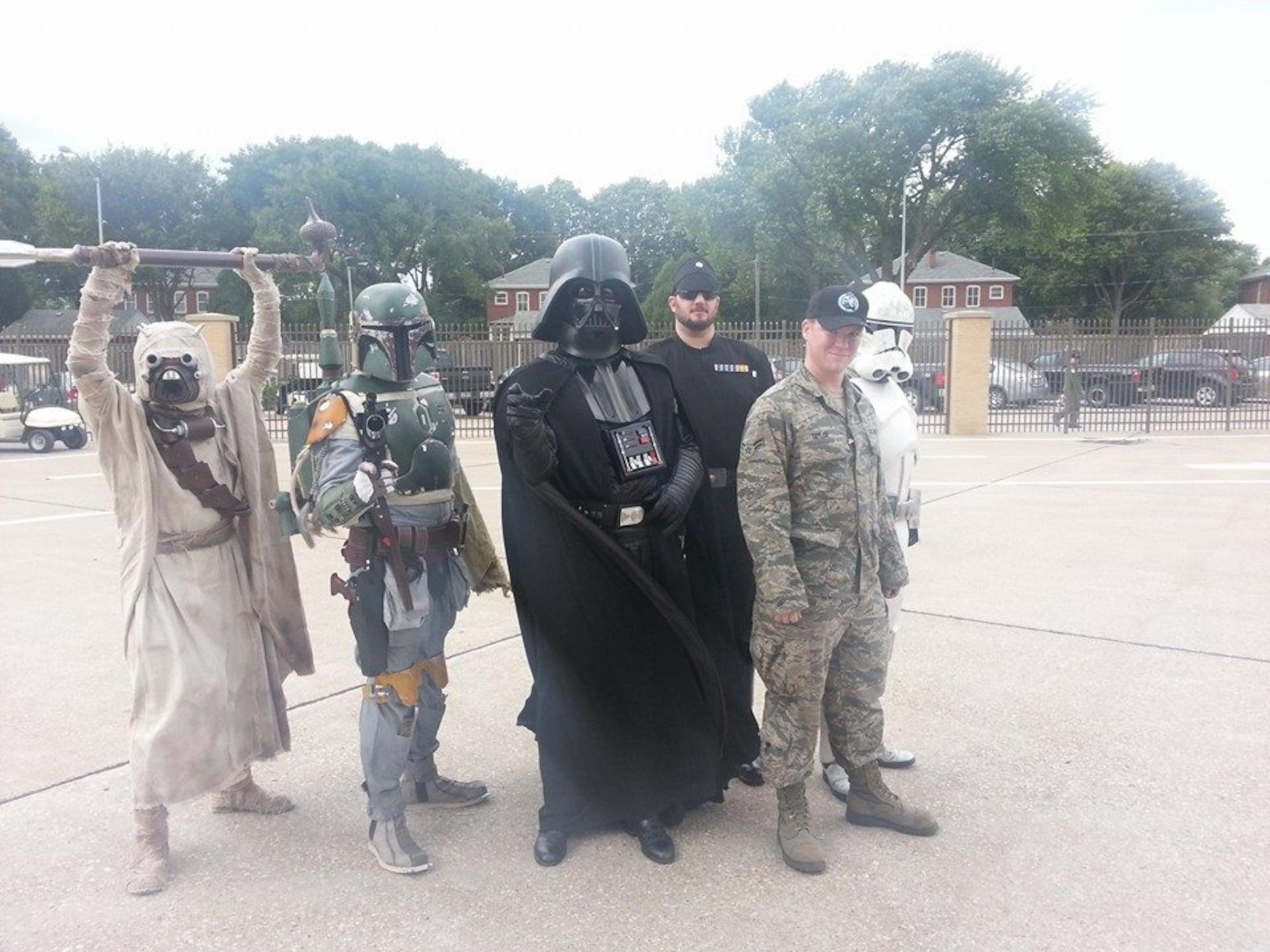 U.S. Air Force Airman 1st Class Erik Taylor, now a technical sergeant, participates as an air show staff member and takes a photo with the 501st Legion at the Offutt Air Force Base Air Show, Offutt AFB, Nebraska, 2015.