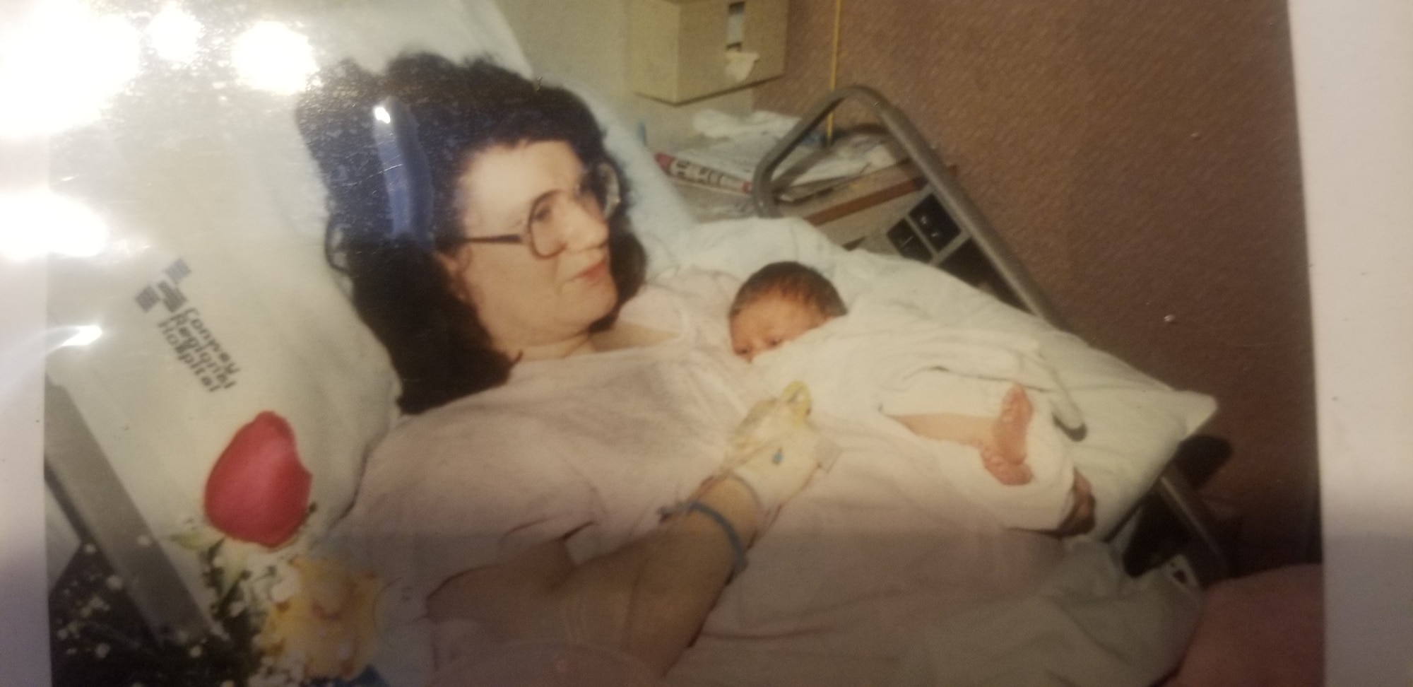 Jamie Sue Hightower, left, holds baby Erik Taylor after birth in Conway, Arkansas, Jan. 9, 1990.