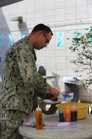 The month of April is Sexual Assault Prevention and Response (SAPR) month, and teal is the color for sexual assault awareness. It is also to show support for survivors of sexual violence and to bring awareness about sexual assault and educating people about how to prevent sexual violence. 



During this month, Naval Health Clinic Lemoore, Branch Health Clinic Fallon, and Branch Dental Clinic Monterey worked together to bring attention to this important issue.



April’s events included educational displays, a teal tie dye T-shirt day, workshops and trainings and a base-wide 5K run around Naval Air Station Lemoore. 



Chief Hospital Corpsman John Tugman creates a teal tie dyed tee to be worn on Denim Day on April 24 in solidarity with those who were sexually assaulted. (DoD photo by Elaine Heirigs/Released)