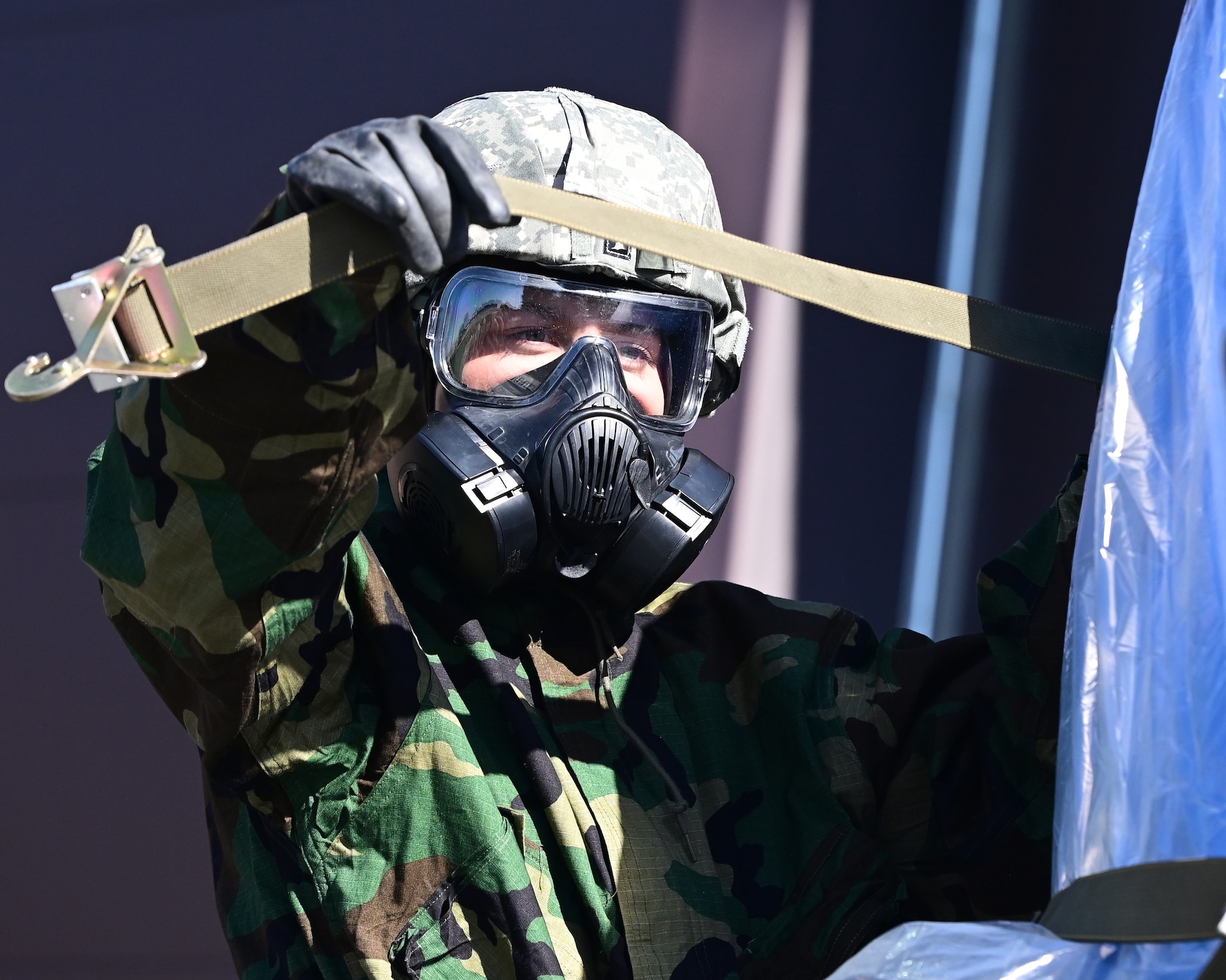 U.S. Air Force Airman from the 133rd Air Transportation Function secured cargo onto a pallet in their Mission-Oriented Protective Posture (MOPP) gear in St. Paul, Minn., April 5, 2024.