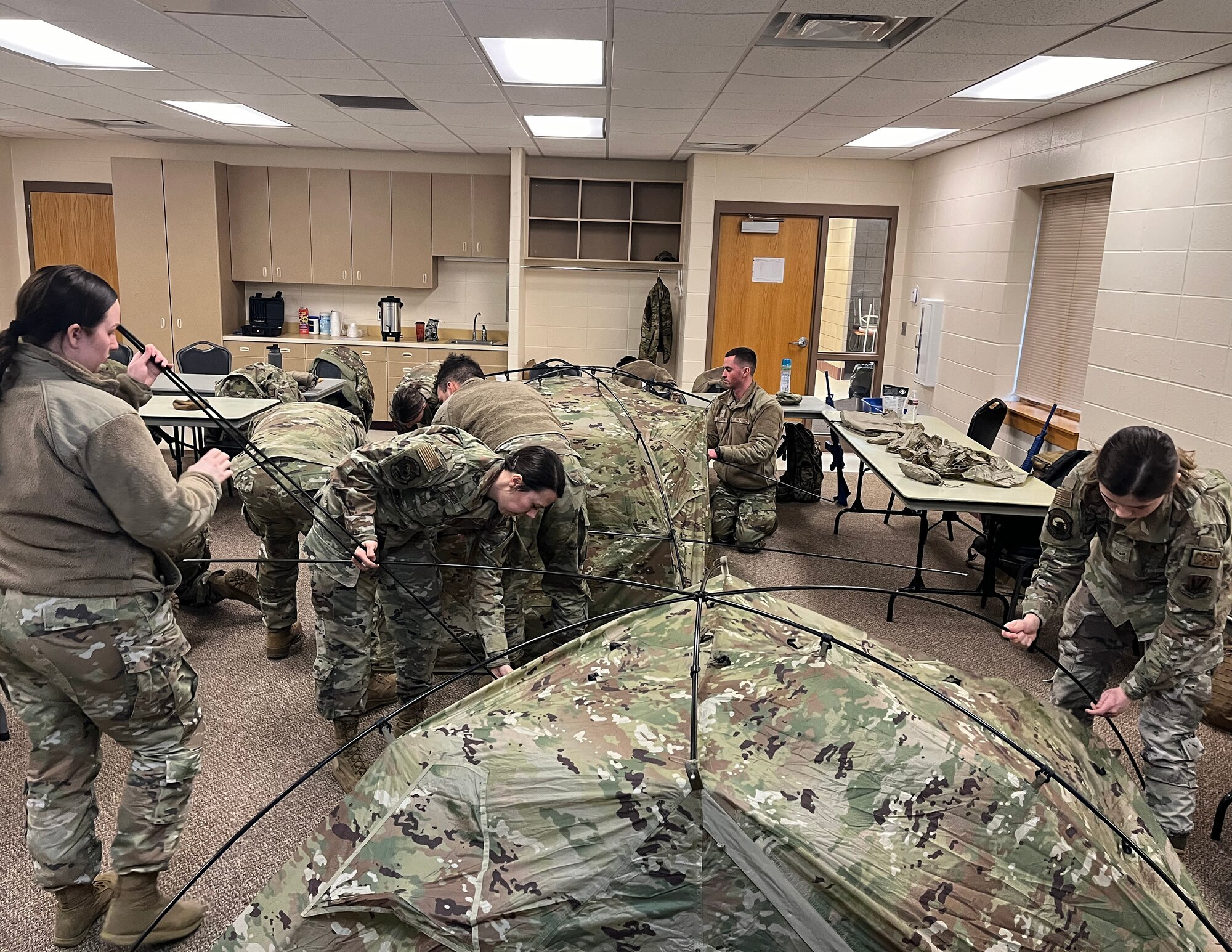U.S. Air Force Emergency Management Airmen from the 133rd, 119th, and 319th Civil Engineer Squadrons receive cold weather equipment in Camp Grafton South, N.D., Feb. 14, 2024.