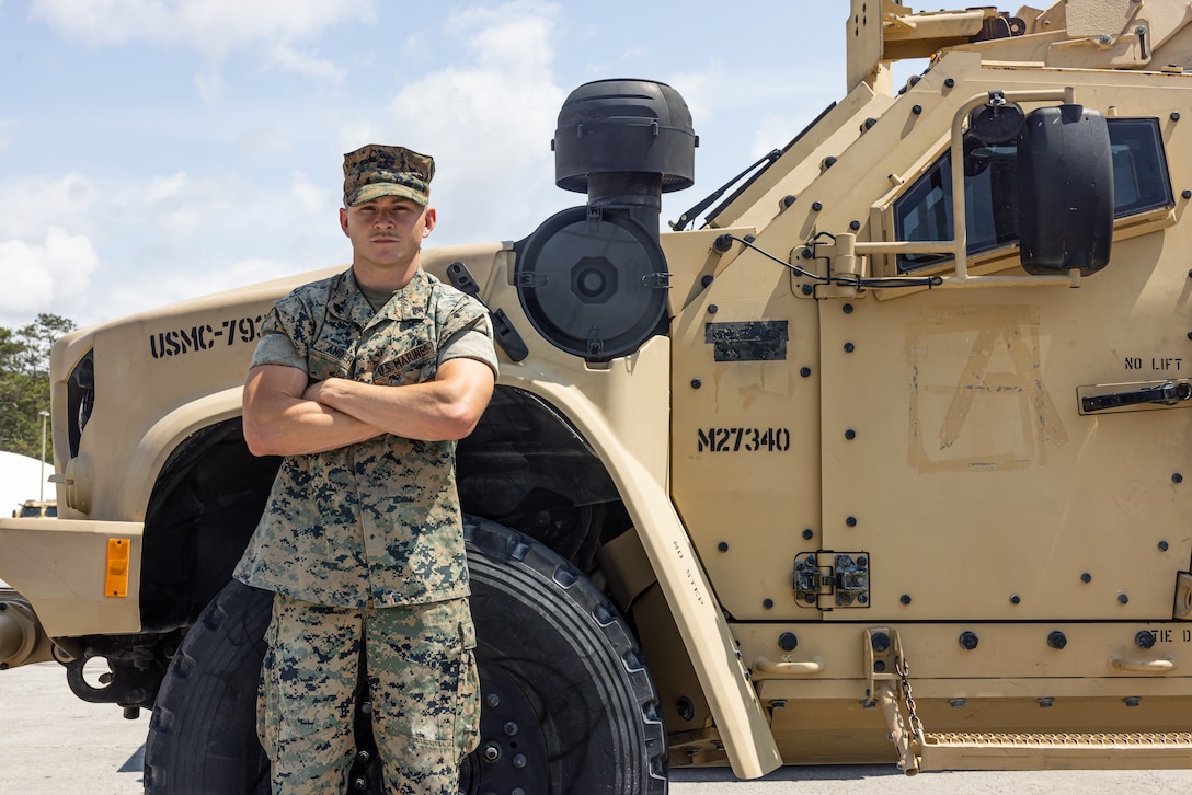 U.S. Marine Corps Cpl. Allan Anderson, a motor vehicle operator with Combat Logistics Battalion 2, Combat Logistics Regiment 2, 2nd Marine Logistics Group, and a native of Carrollton, Georgia, poses for a portrait with a joint light tactical vehicle on Camp Lejeune, North Carolina, April 10, 2024. Each week, 2nd MLG recognizes one outstanding Marine or Sailor as the Warrior of the Week, who goes above and beyond in their duties and embodies the whole Marine concept. Anderson was selected for his leadership skills and proficiency in convoy operations during a Marine Air-Ground Task Force Warfighting Exercise. When asked what piece of advice he would give to his past self, Anderson said, “Don’t let the little things in life get in the way of your goals. Keep your head up and you can overcome any obstacle that gets in your way.” (U.S. Marine Corps photo by Cpl. Jackson Kirkiewicz)