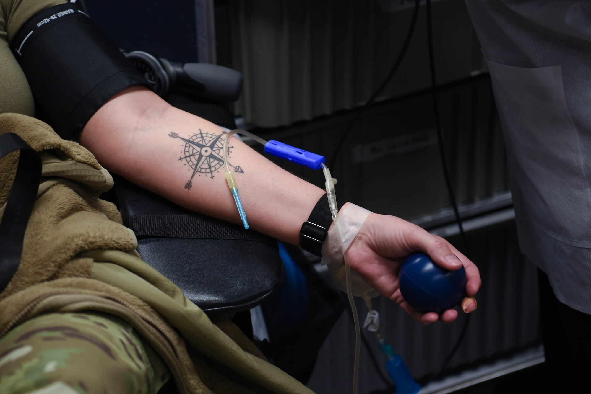 U.S. Air National Guard Member Tech. Sgt. Samantha McKinney squeezes a ball while having her blood drawn by the 88th Medical Group for a base wide blood drive on April 5, 2024 in Springfield, Ohio. The 178th Wing participates in The Armed Services Blood Program which provides quality blood products for service members, veterans and their families in both peace and war. (U.S. Air National Guard photo by Airman 1st Class Josh Kaeser)