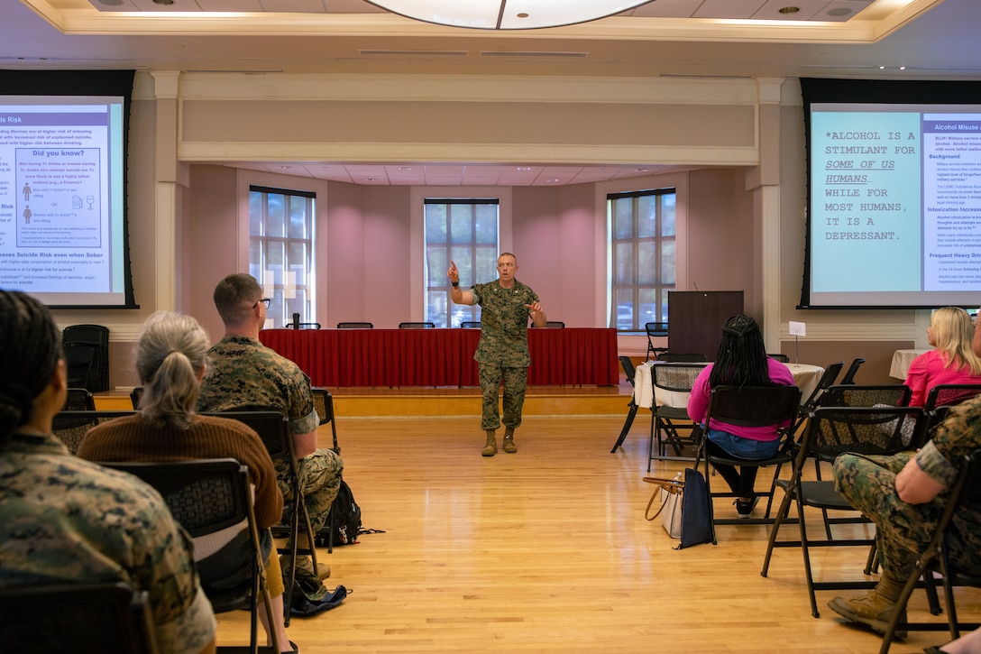U.S Marine Corps Capt. Jergen Campbell, the suicide prevention program coordinator for headquarters Marine Corps, delivers a presentation on suicide awareness during a Suicide Prevention Wellness Symposium on Marine Corps Base Camp Lejeune, North Carolina, April 17, 2024. During the symposium, mental health professionals from Headquarters Marine Corps discussed important issues regarding mental well-being with service members and civilian contractors with II MEF. (U.S. Marine Corps photo by Lance Cpl. Jack Labrador)