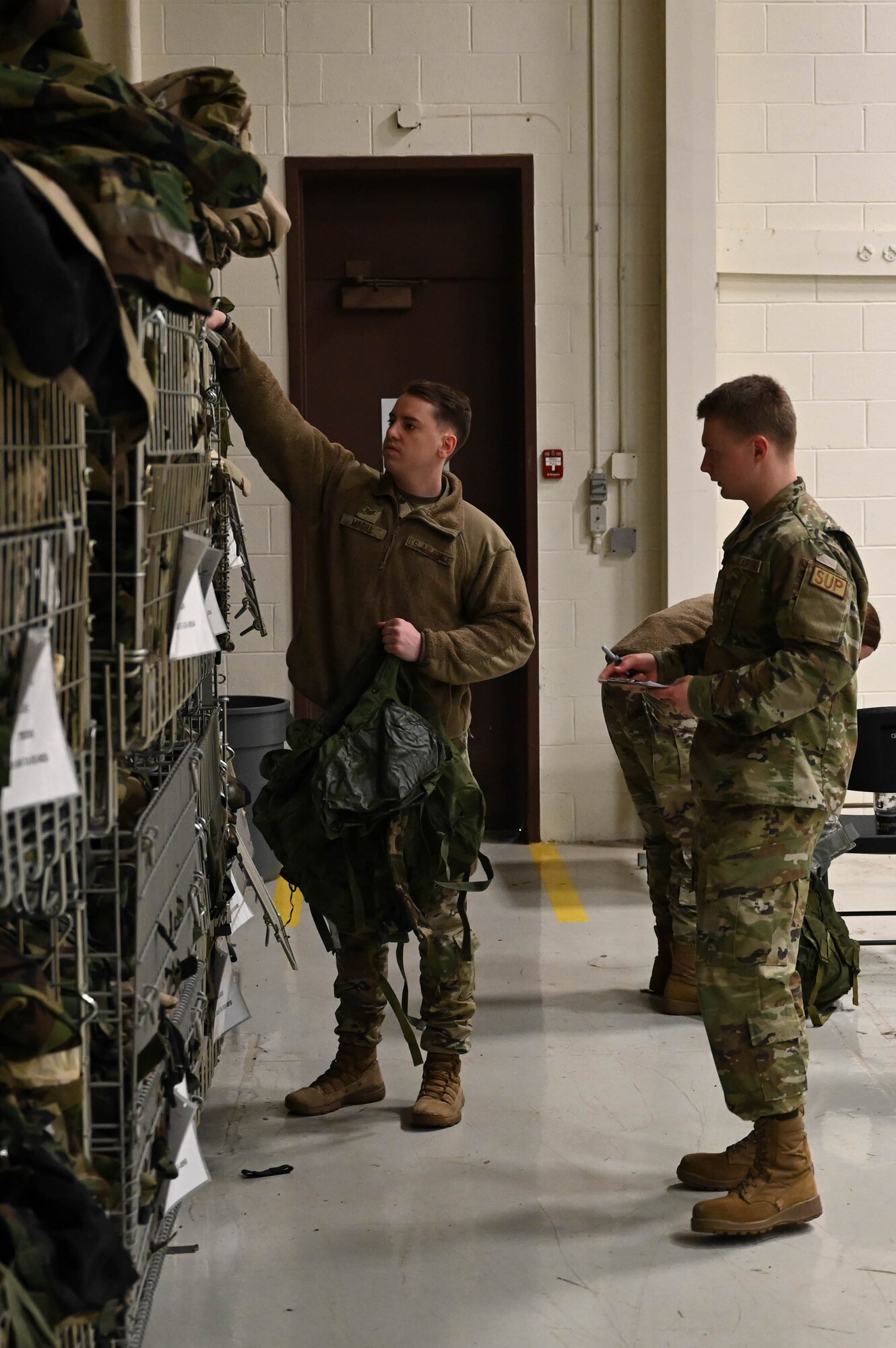 U.S. Air Force airmen from the 178th Mission Support Group prepare for a simulated pre-deployment function line as part of Operation Guidewire at Springfield-Beckley Air National Guard Base, Ohio, April 5, 2024. Operation Guidewire reinforces the wing’s ability to quickly deploy on short notice. (U.S. Air National Guard photo by Staff Sgt. Constantine Bambakidis)