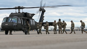 U.S. Air Force airmen from the 178th Mission Support Group and 123d Air Control Squadron board a UH-60 Black Hawk from 1st Battalion, 137th Aviation Regiment during Operation Guide Wire on Springfield-Beckley Air National Guard Base, Ohio, April 4, 2024. The UH-60 transported airmen to a landing zone at Wright-Patterson Air Force Base, where a tactical operations center was set up. (U.S. Air National Guard photo by Staff Sgt. Constantine Bambakidis)