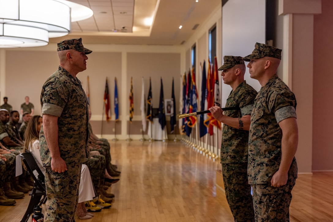 U.S. Marine Corps Col. Dennis W. Sampson (left), the commanding officer for the 26th Marine Expeditionary Unit (Special Operations Capable) (MEU(SOC)), relieves Sgt. Maj. James Horr (center) of his duties as Sergeant Major the 26th MEU(SOC) during a relief and appointment ceremony at Marine Corps Base Camp Lejeune, North Carolina, Apr. 19, 2024. The relief and appointment ceremony serves as the official changeover between Sergeants Major, honoring the outgoing Sergeant’s Major contributions during his tenure and allowing the oncoming SgtMaj to introduce himself to the Marines now under his charge. (U.S. Marine Corps photo by Sgt. Nayelly Nieves-Nieves)