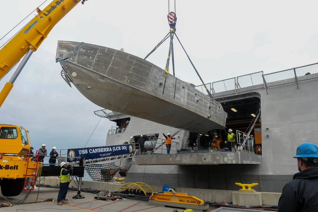 An unmanned surface vehicle is craned aboard the Independence-variant littoral combat ship USS Canberra (LCS 30), as a part of the first embarkation of the Mine Countermeasures (MCM) mission package, April 23. The MCM mission package is an integrated suite of unmanne