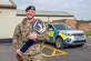 Senior Master Sergeant Shannon G. Hutto, 420th Air Base Squadron Security Forces operations superintendent, smiles for a photo while holding a “DEFENSOR FORTIS” championship belt on RAF Fairford, England, March 26, 2024. Hutto was recently awarded the Air Force’s 2023 Government Employees Insurance Company (GEICO) Military Service Award. The award honors one currently serving enlisted member from each of the six Armed Services and the National Guard for their achievements and contributions on-duty and off-duty for their military and civilian communities. (U.S. Air Force photo by Staff Sgt. Jessica Avallone)