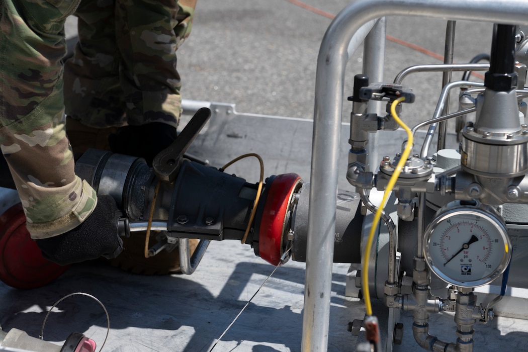 U.S. Air Force Senior Airman Chad Tidwell, 23rd Logistics Readiness Squadron fuels distribution supervisor, hooks a fuel hose to a Versatile Integrating Partner Equipment Refueling kit at Perry-Houston County Airport, Georgia, April 12, 2024. Tidwell supported refueling operations during Exercise Ready Tiger 24-1 at one of two contingency locations established for Agile Combat Employment. During Ready Tiger 24-1, the 23rd Wing will be evaluated on the integration of Air Force Force Generation principles such as Agile Combat Employment, integrated combat turns, forward aerial refueling points, multi-capable Airmen, and combat search and rescue capabilities. (U.S. Air Force photo by Senior Airman Rachel Coates)